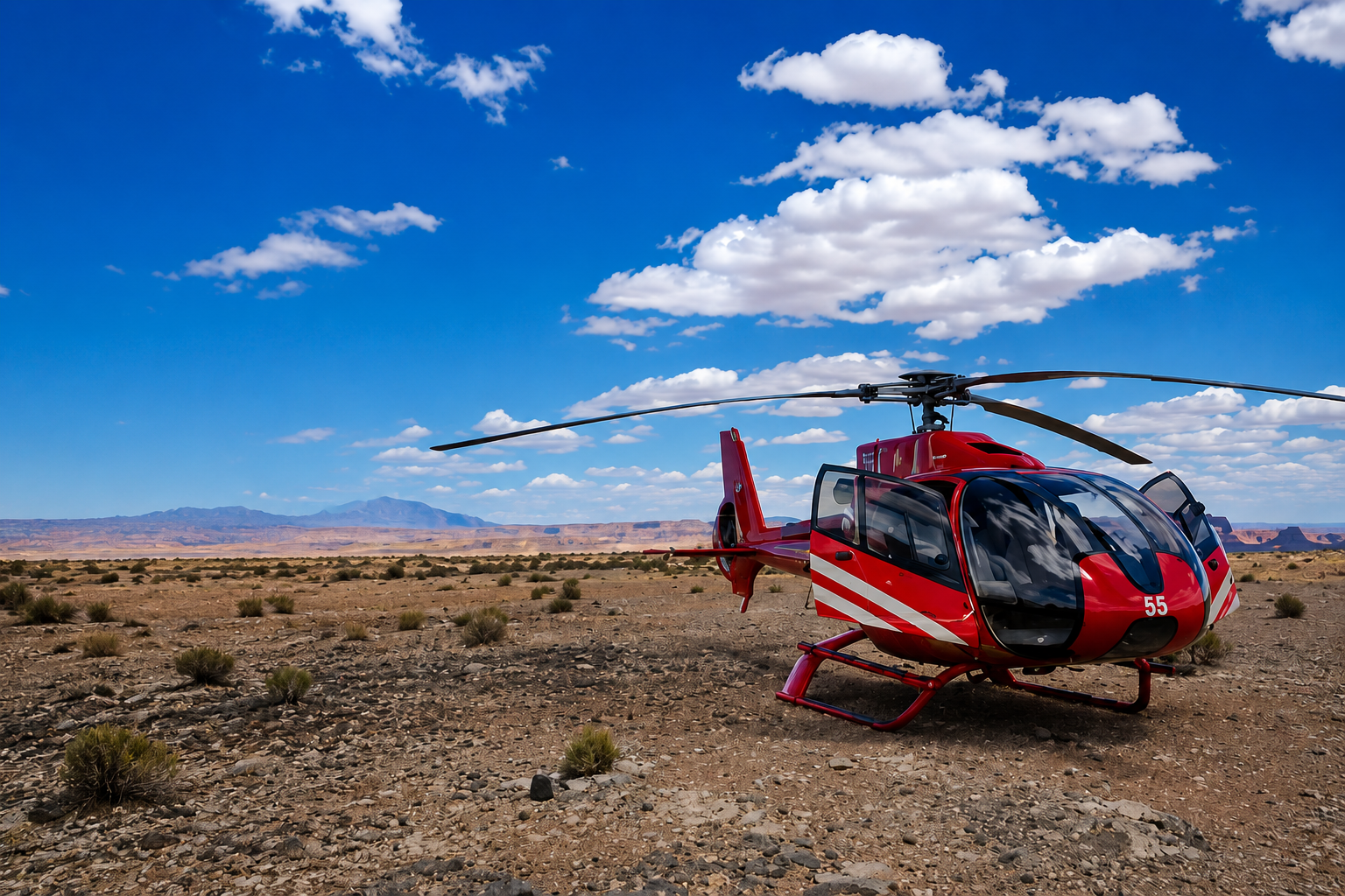 **Alt text:** Red helicopter parked on a rocky desert landscape under a bright blue sky during a trip captured with Ray-Ban Meta glasses.